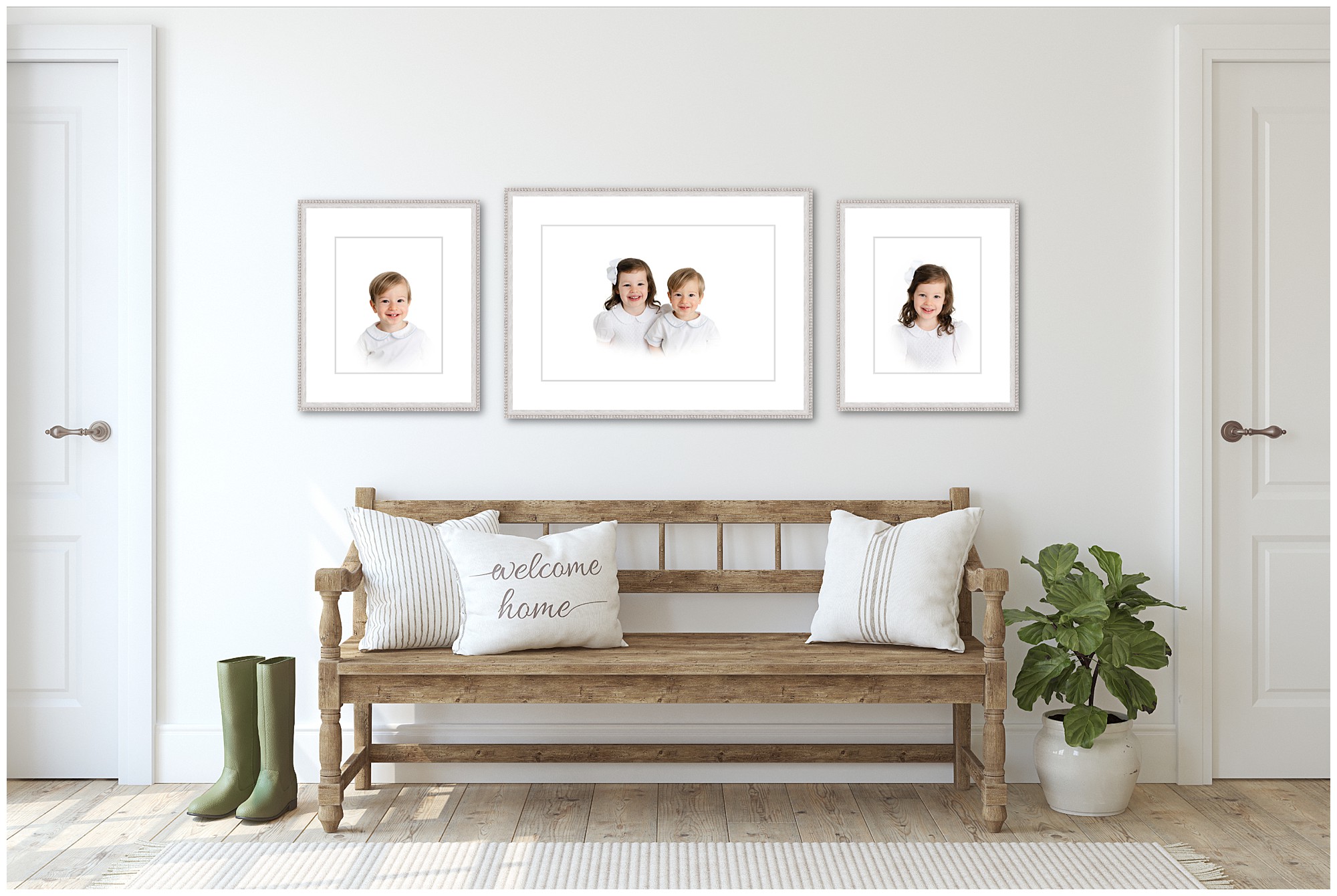 Three Atlanta heirloom portraits framed and hanging on the wall above a bench.