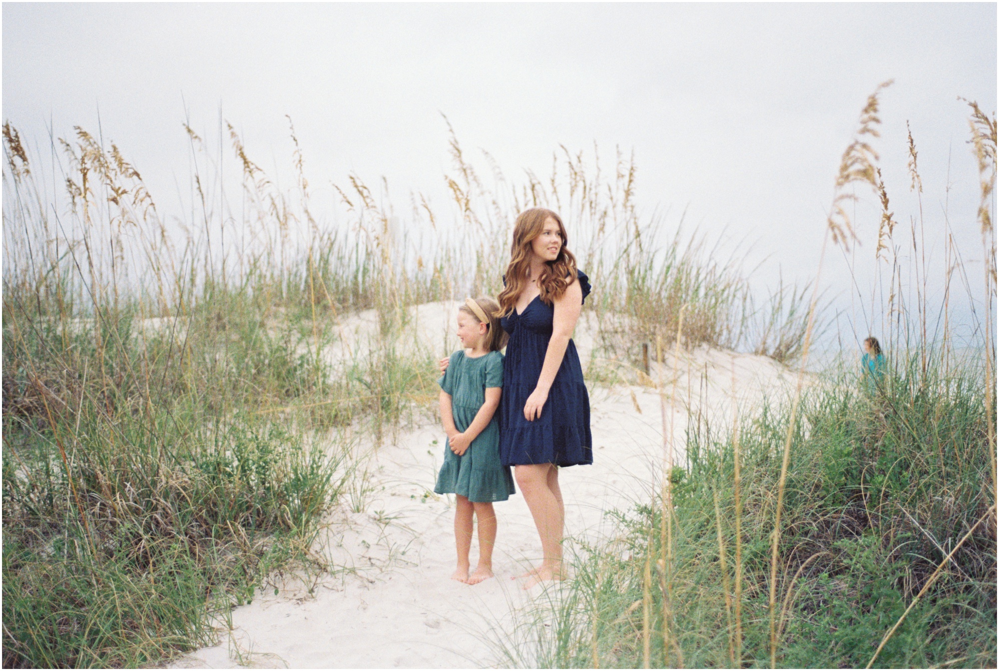 Portrait of family on film on the beach dunes.